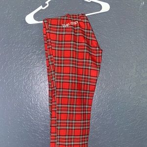 Red plaid pants witch stitching on the butt